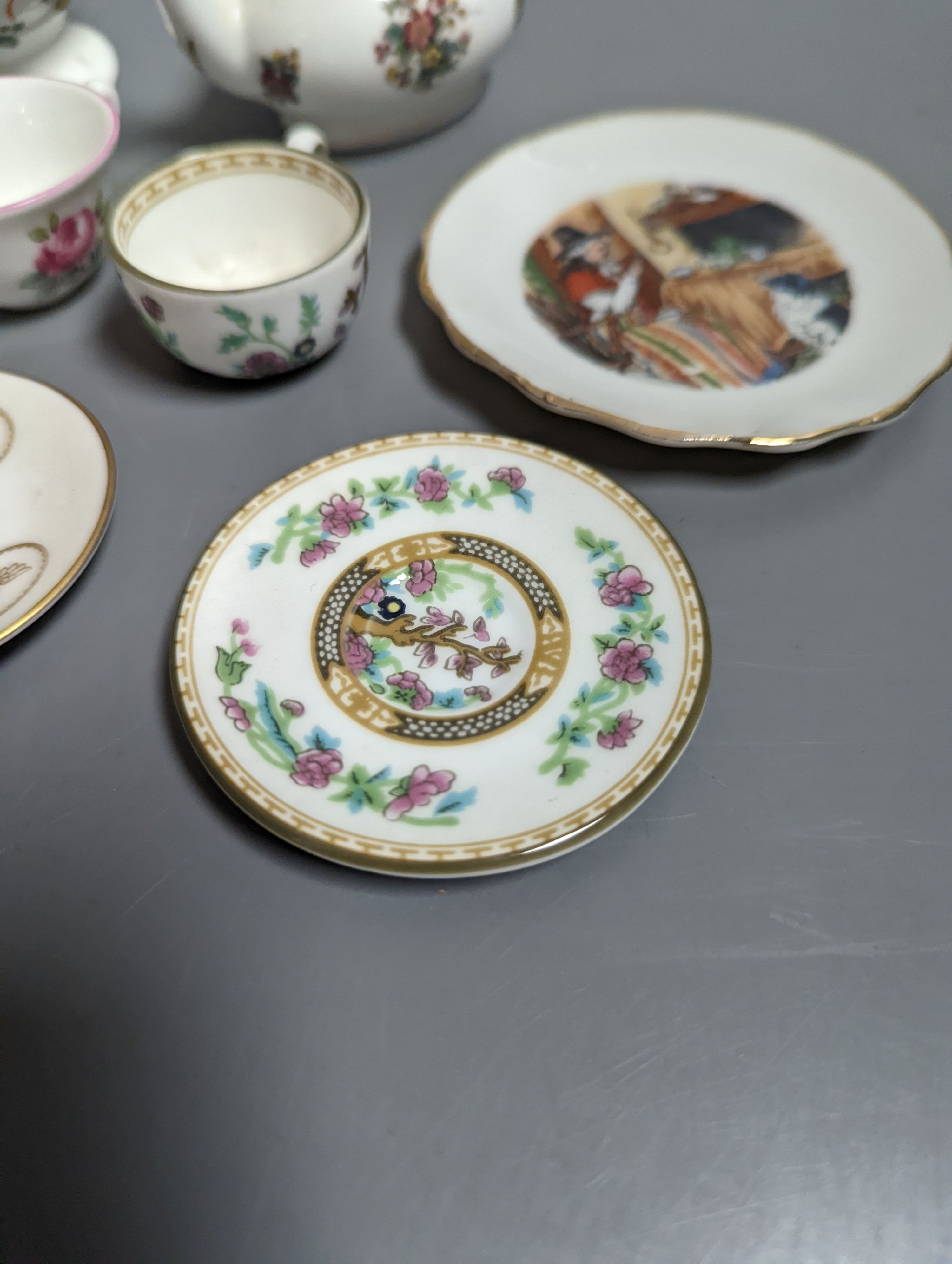 Various miniature Coalport bone china tea sets, a Staffordshire pottery moneybox and other china